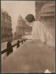 Isadora Duncan on a balcony at the Hotel Metropole, Brussels