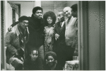 Group portrait of (left to right): Bob Rogers, Ishmael Reed, Jayne Cortez, Léon-Gontran Damas, Romare Bearden, Larry Neal; seated: Nikki Giovanni and Evelyn Neal, in New York City, 1969