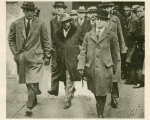 Marcus Garvey, accompanied by U.S. marshals, on the way to federal prison in Atlanta