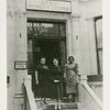 Amy Ashwood Garvey with two unidentified women on the steps of the Afro Women's Centre