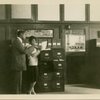 William Pickens and unidentified woman in the office of "The Crisis"