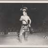 Tom Two Arrows performing before an audience in Asia