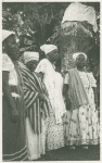 View of priestesses, two wearing striped shawls