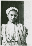 Candid close-up portrait of woman with shawl and beaded necklace
