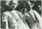 Close-up of two younger priestesses