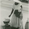 Woman vendor preparing food on a coal pot