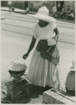 Woman vendor preparing food on a coal pot