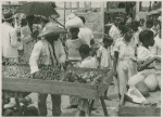 Market scene, man selling vegetables