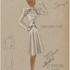 Piping of satin or braid around scalloped pockets.