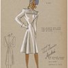 Fine pleated yoke with tiny buttons to button coat at neck.