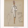 Boxy straight coat with raglan sleeves flaring to cuffed wrist and cord trim on pockets and closing.