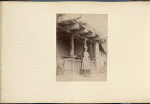 A man in front of house