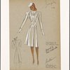 Fitted coat with nipped-in waist, seam pockets and button trim.