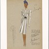 Belted fitted long-sleeved dress or coat with flowing skirt and scrolled embroidery embellishment on bodice.