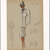 Tunic length suit jacket in tweed with pleated skirt velvet collar and ascot.