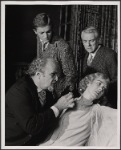 Jerome Dempsey, Valerie Mahaffey, Alan Coates and Dillon Evans in the 1977-80 Broadway revival of Dracula, sets by Edward Gorey