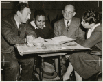 Carlton Moss (seocnd from left) with R.H. Gordon, Frank Schiffman, and Stella Garvin.