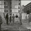 Contact sheet of pre-production location shooting with stand-ins. Vacant lot with three women and two men standing on tar paper with crew at perimeter of shot
