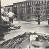 George Chakiris, Jerome Robbins, Eddie Verso, crew, dancers: exterior location: vacant lot, dancer in background, crew in foreground