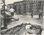 George Chakiris, Jerome Robbins, Eddie Verso, crew, dancers: exterior location: vacant lot, dancer in background, crew in foreground