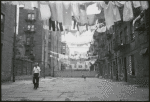 Location scouting contact sheets.  Laundry hung out between apartment buildings