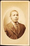 Studio portrait of a young man wearing tie and stick pin.