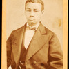 Half-figure portrait of man wearing bow tie.
