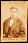 Half-figure portrait of man wearing bow tie.