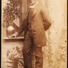 Full-length portrait of man, with studio props.
