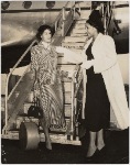 Unidentified Brandford model (left) and Barbara Watson at airplane ramp.