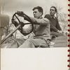 two men driving a truck