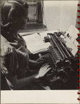 woman working at a typewriter