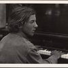 Henry Cowell playing the piano