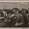 The Fuhrer visited a Luftwaffe air base and sat near the Christmas tree in the midst of the troops.  He visited anti-aircraft positions in the Western Air Defense Zone, where a gunner presented him with a hand-carved wooden eagle