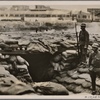 England's foreign policy leads to high tension between Japan and Great Britain, so that Japan is forced to declare a blockade against the English Concession in Tientsin.  Our picture shows Japanese soldiers near a fortified position in Tientsin.