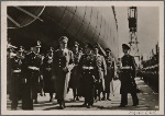 [The Fuhrer and Grand Admiral Raeder on the way to the launching of the 35,000-ton battleship "Tirpitz" from the Navy building yard at Wilhemshaven.]