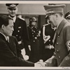 The warm friendship between Japan and Germany finds expression in a Japanese art exhibition in Berlin.  The Fuhrer greets Japanese Ambassador Oshima