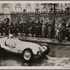 Racing cars drive past the Fuhrer during the International Automobile show.