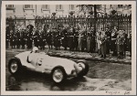Racing cars drive past the Fuhrer during the International Automobile show.