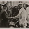 The International Automobile show is opened by the Fuhrer.  He greets expert German drivers in front of the Reichs-chancellery