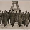 The Fuhrer inspects Paris, which has quickly returned to normal life under German occupation troops.  At the Fuhrer's side are professors Giesler, Speer and Breker.  In the background is the Eiffel Tower
