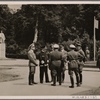 On June 21st the Fuhrer arrived in Compiegne to sign the armistice.  Our picture shows Adolf Hitler speaking with the Commanders-in-Chief of the Armed Forces and Reichsminister Hess.  In the background is the monument to Foch.