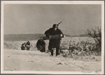 The enemy can see this stretch of ground.  The last 80 meters are covered in double-time.  A supply troop brings building materials to the German advance lines far from the bunkers of the Westwall