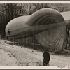 [The artillery on the Westwall stands watch.  On clear days an artillery observer ascends in a captive balloon to direct (the guns') fire.]