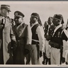 Chief of Staff Lutze visits the new Italian settlements in Libya. The Chief of Staff and His Excellency Russo inspect ranks of Askaris (native soldiers) in Nalut.