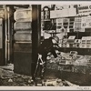 England has begun to experience anxious days because of bomb attacks by the Irish Republican Army.  Our picture shows a shop badly damaged by a bomb.