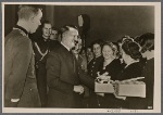 [The Fuhrer, along with Reich Labor Front leader Dr. Ley, met with the outstanding men and women armaments workers who had received the War Merit Cross and thanked them for their efforts.]