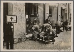 [The great air defense drill in Berlin demonstrated the perfect discipline of the capital's population.  In our picture, air raid wardens carry out "two dead" during the practice.]