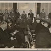 The gang of English warmongers tried once again to conceal a defeat.  In the Reich Ministry of Proganda Lieutenant Colonel Schumacher (next to Reich Press Chief Dr. Dietrich) and a few of his pilots gave a report to the domestic and foreign press regarding the squadron's victorious engagement, in which 36 British bombers fell victim