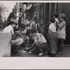 Children playing cards in front yard in slum area near Union Station. Section inhabited by both whites and Negroes. Washington, D.C.